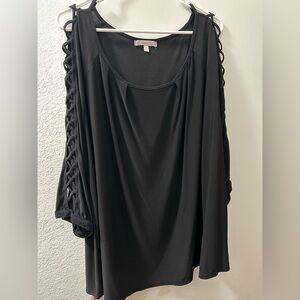 3x criss crossed on the arms black shirt